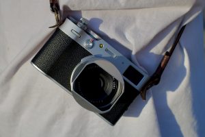 what does the mode button on a nikon aculon rangefinder do